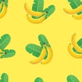 Bananas and banana leaves seamless pattern. Two bananas and two green leaves on a yellow background. Vector pattern. Royalty Free Stock Photo